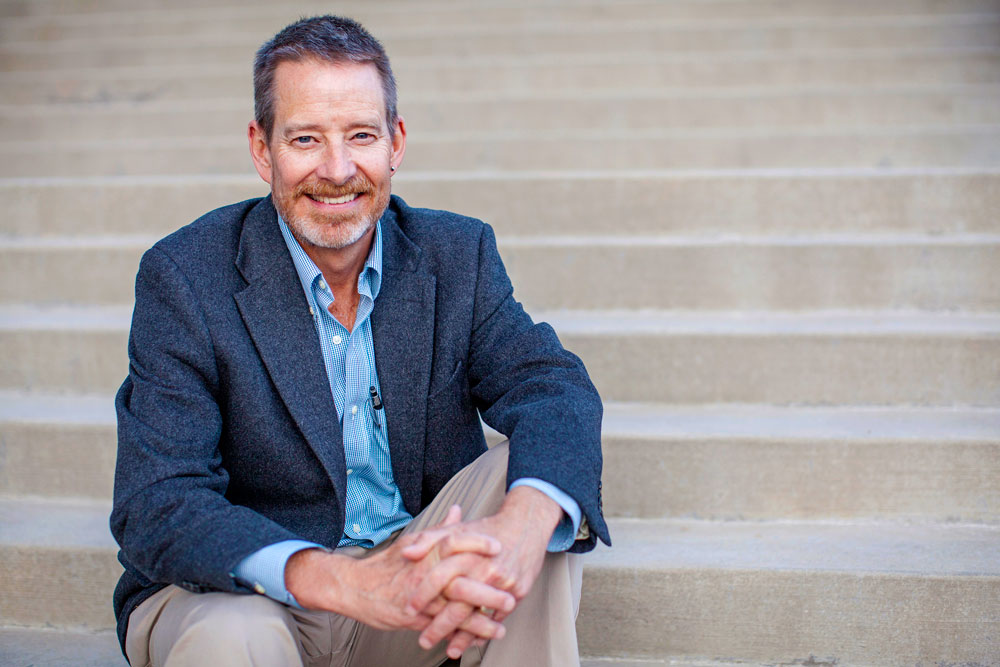 Dr. Charles "Chip" Benight sitting on stairs