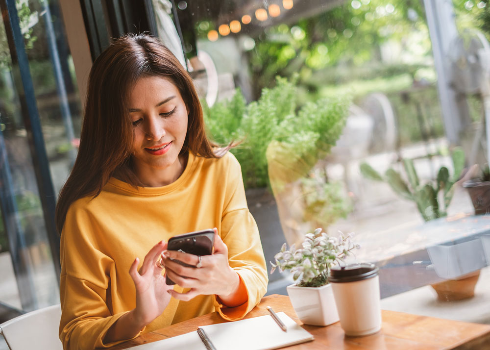 Woman reading on her mobile phone