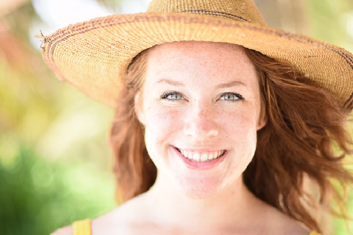 a woman smiles at the camera