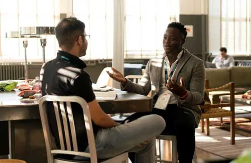 Two male friends talking 